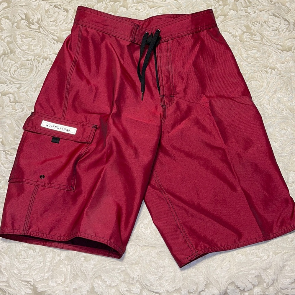 Men’s Quicksilver red swim trunks. Size 30.